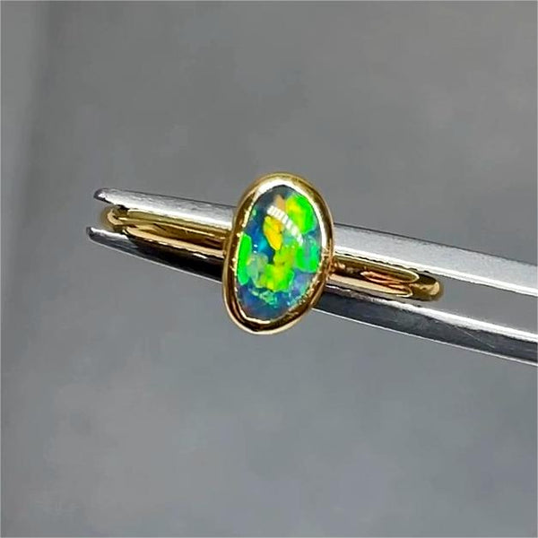 0.62ct black opal 18K ring