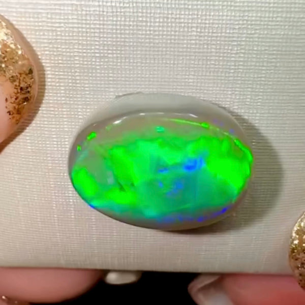 6.7ct black opal 15.8x 12.4x4.9MM