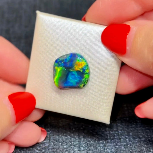 7.44ct black opal 16.91x 16.01x4.6MM